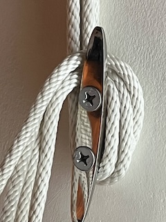 Detail photo of the curtain ropes “tied” around their wall anchor