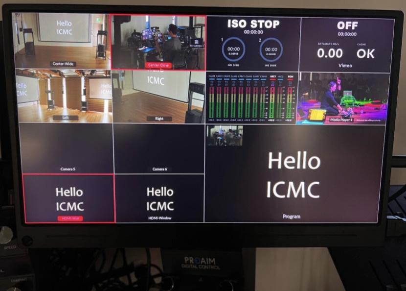 Right video monitor set to ATEM’s “multi-view”, showing four cameras, the presenter’s laptop selected as HDMI source for both projectors, while silently not recording or streaming, shortly after an event that wanted to cut to a photo of Celeste Betancur-Gutierrez conducting SLOrk. Camera Close provides a side-rear selfie view of Constantin Basica who ingeniously devised most of the CCRMA Stage technical infrastructure and kindly supplied this series of photographs (just in time for ICMC 2025).