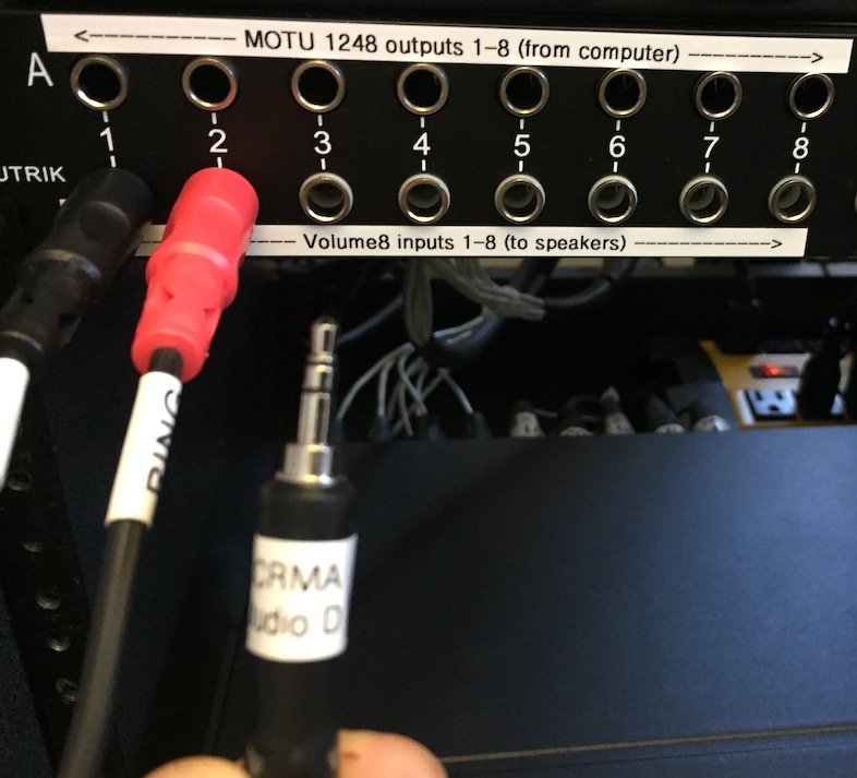 How to plug an analog source (from a headphone jack) into channels 1+2 of the Studio D sound system via the patch bay.