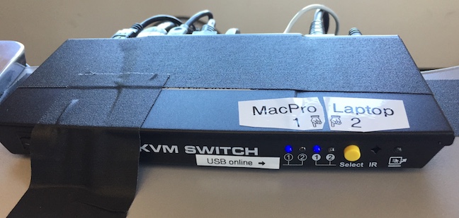 Studio E KVM Switch. Note the two LEDs on the left show you which of the two computers have USB “online”, while the two LEDs on the right show you which one is currently selected.