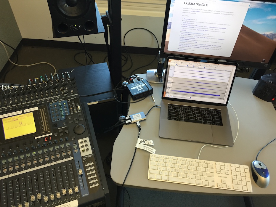 Studio E with a USB-C laptop connected to keyboard, video monitor, mouse, and MOTU audio interface